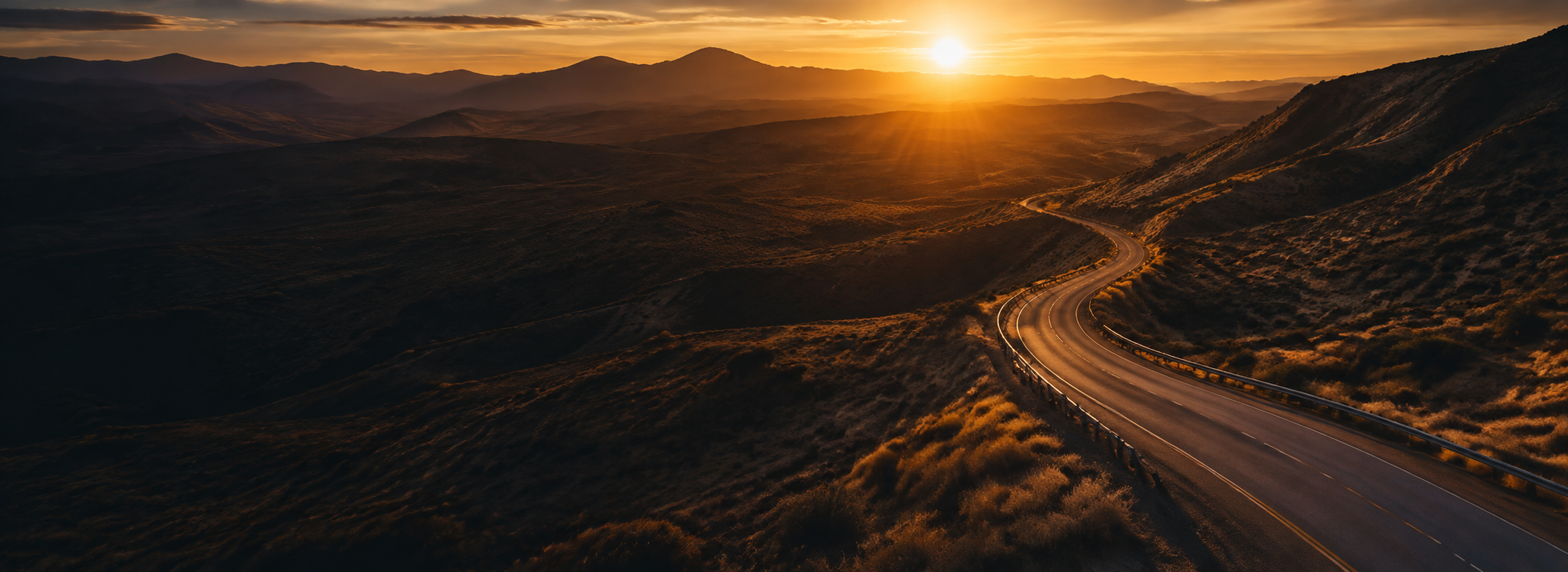 A white semi truck heading toward the sunset